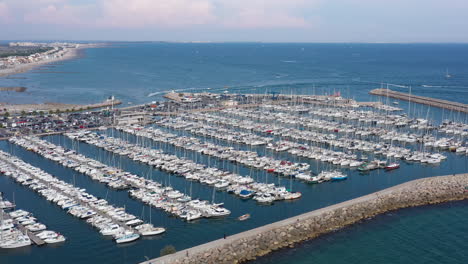 Port-full-of-boats-Palavas-les-Flots-docked-vessels-aerial-view-sunny-day-France